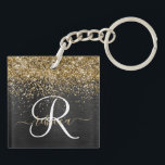 Custom Gold Glitter Black Sparkle Monogram Keychain<br><div class="desc">Easily personalize this trendy elegant keychain design featuring pretty gold sparkling glitter on a black brushed metallic background.</div>