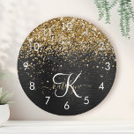 Custom Gold Glitter Black Sparkle Monogram Round Clock<br><div class="desc">Easily personalize this trendy elegant round clock design featuring pretty gold sparkling glitter on a black brushed metallic background.</div>