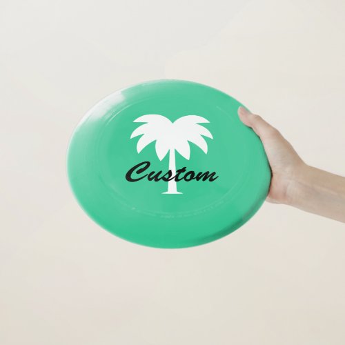 Custom green beach frisbee with palm tree logo