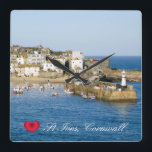 Custom Heart St Ives Harbor Pier Cornwall Photo Square Wall Clock<br><div class="desc">Customizable photos of Cornwall’s beauty, this one of a sunny morning at the picturesque fishing harbor of St Ives on the North Coast of Penwith. Colorful boats are moored by the pier on which are two lighthouses and piles of lobster pots. The working harbor is lined with old houses, shops,...</div>