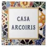 Custom House Name Sign Colorful Spanish Mosaic Ceramic Tile<br><div class="desc">Please note: This is a faux mosaic. It is a printed graphic giving the illusion of mosaic stones. "custom house name plate", "personalized house name plaque", "personal customized text sign", "modern abstract design ceramic tile", "multicolored colorful gaudi mosaic", "building group home name art", "mustard yellow red navy blue", "last family...</div>