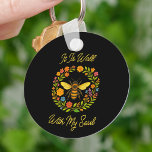 Custom "It Is Well With My Soul" Boho Honeybee Keychain<br><div class="desc">Add a touch of inspiration to your day with this round keychain featuring our signature “It Is Well With My Soul” honeybee design. With vibrant florals and golden script on a bold black background, this small accessory delivers a big message of peace and faith. Coordinates beautifully with our matching tees,...</div>