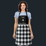 Custom Kitchen Heart Home Buffalo Plaid Black Apron<br><div class="desc">This custom apron features a white and black buffalo plaid pattern with solid black at the top where your name can be added at the top. The apron says " kitchen is the heart of the home."</div>
