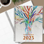 Custom Name 2023 Planner<br><div class="desc">This unique Planner is decorated with a brightly coloured mosaic tree. Customize it with your name and year. To edit further use the Design Tool to change the font, font size, or color. Because we create our artwork you won't find this exact image from other designers. Original Mosaic © Michele...</div>