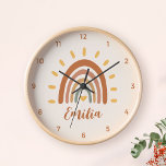 Custom Name Boho Earth Tone Rainbow Sun Clock<br><div class="desc">The Custom Name Boho Earth Tone Rainbow Sun wall clock is a unique and stylish piece of home decor that combines bohemian and earthy elements with a vibrant rainbow sun. In addition to the striking graphic, the clock can also be customized with your own name, making it a truly personalized...</div>