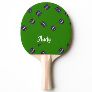 Custom name drums pattern on green ping pong paddle