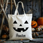 Custom Name Jack O Lantern Pumpkin Trick Or Treat Tote Bag<br><div class="desc">Make your child's Halloween extra special with our Custom Name Jack O Lantern Pumpkin Trick Or Treat Tote Bag. This festive tote features a charming jack-o'-lantern design, perfect for capturing the spooky spirit of Halloween. Personalized with your child's name, this bag is not only practical but also a delightful keepsake...</div>