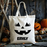 Custom Name Jack O Lantern Pumpkin Trick Or Treat Tote Bag<br><div class="desc">Elevate your Halloween experience with our Custom Name Jack O’ Lantern Pumpkin Trick Or Treat Tote Bag! Designed with a charming jack-o’-lantern pumpkin featuring a friendly face, this tote bag adds a touch of festive fun to your child’s trick-or-treating adventures. Perfectly sized for kids, it combines style and functionality, ensuring...</div>