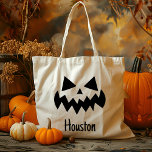 Custom Name Jack O Lantern Pumpkin Trick Or Treat Tote Bag<br><div class="desc">Celebrate Halloween in style with our Custom Name Jack O' Lantern Pumpkin Trick Or Treat Tote Bag! This charming tote features a classic jack o’ lantern design with a friendly pumpkin face, perfect for adding a festive touch to your child’s trick-or-treating adventures. Customizable with your child's name, this bag is...</div>