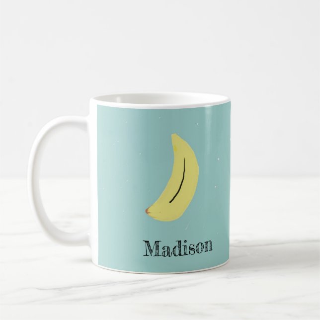Custom name painted banana on blue coffee mug (Left)