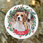 Custom Pet Dog Photo Watercolor Wreath Christmas Ceramic Ornament<br><div class="desc">Decorate your tree or give a special gift this holiday season with this elegant pet photo in a wreath design christmas ornament, and matching decor. This dog christmas ornament features a watercolor green and red wreath with holly and berries. Personalize with name front, year back . This pet christmas ornament...</div>