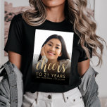 Custom Photo Cheers 21st Birthday Party T-Shirt<br><div class="desc">This 21st birthday party t-shirt features the guest of honor's photo with a gold-colored text overlay. The word "cheers" appears in elegant gold-colored calligraphy script, followed by "to 21 years" and the guest of honor's name and birthday in sans serif font. A dark screen helps make the text pop. A...</div>