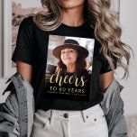 Custom Photo Cheers 60th Birthday Party T-Shirt<br><div class="desc">This 60th birthday party t-shirt features the guest of honor's photo with a gold-colored text overlay. The word "cheers" appears in elegant gold-colored calligraphy script, followed by "to 60 years" and the guest of honor's name and birthday in sans serif font. A dark screen helps make the text pop. A...</div>