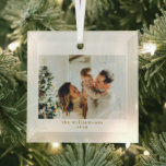 Custom Photo Christmas Minimalist Elegant Family Glass Ornament<br><div class="desc">This elegant glass ornament features a clean white frame, soft golden text, and your favorite family photo for a timeless holiday keepsake. The simple, modern design feels warm yet refined—perfect for gifting or displaying on your own Christmas tree. This ornament captures the joy of the season and makes a beautiful...</div>