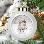 Custom Photo First Christmas Engaged Black Script Ceramic Ball Christmas Ornament<br><div class="desc">Commemorate your engagement with this beautiful modern keepsake ornament. The black text reads "Our first Christmas engaged, " with the word "engaged" in elegant handwriting script with flourishes before and after. Replace the sample image with your favorite photo, and add your names and the year. A white gradient filter helps...</div>