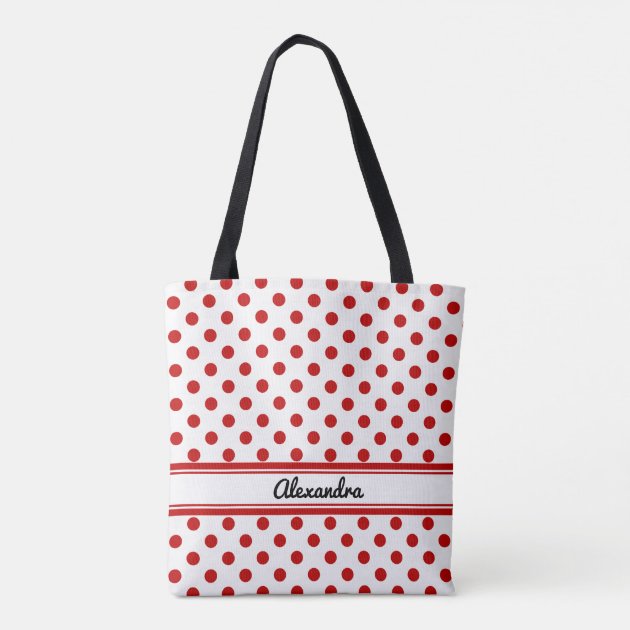 red and white polka dot luggage