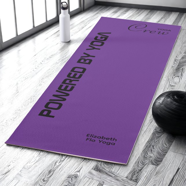 Custom Print Yoga Crew Royal Purple Mat (Royal purple yoga mat on a studio floor.)