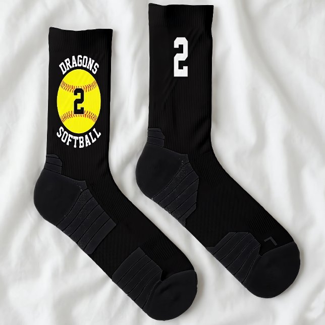 Custom Softball Team Name and Player Jersey Number Socks (Custom softball team socks on bed. Personalized with softball team name and player jersey numbers.)