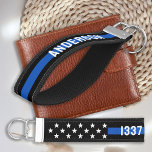 Custom Thin Blue Line Personalized Police Officer Wrist Keychain<br><div class="desc">Introducing the perfect gift for any law enforcement officer - a customized keychain featuring a bright blue "thin blue line" design with an American flag and stars. This modern design is sure to catch the eye of any police officer, policeman, policewoman, or cop. Personalize the keychain with your loved one's...</div>