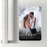 Custom Wedding Photo Love White Script Magnet<br><div class="desc">Celebrate your wedding with this keepsake flexible magnet, featuring the word "love" in elegant white handwriting script with swashes at the beginning and end. Personalize it with your names and wedding date, and replace the sample image with your favorite wedding photo. A black gradient filter helps make the text pop....</div>