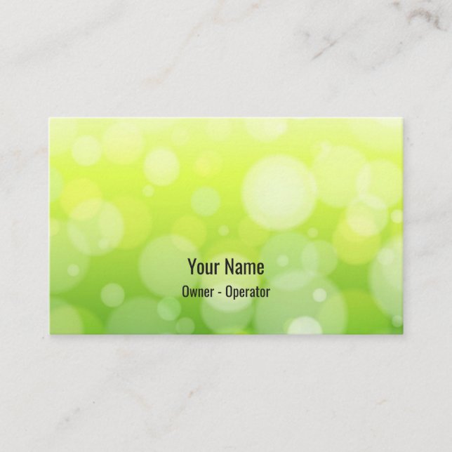 Customizable green bokeh business card (Front)