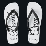 Customized Bride Elegant White Flip Flops<br><div class="desc">Customized Bride Elegant White Flip Flops Have fun after your wedding in a pair of stylish modern bride flip flops. "Bride" in large black script on white background with first initial of bride and groom names. Last name and wedding date customized on right shoe. Great fashion choice for casual wear...</div>