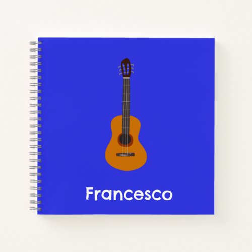 Cute acoustic guitar in blue notebook