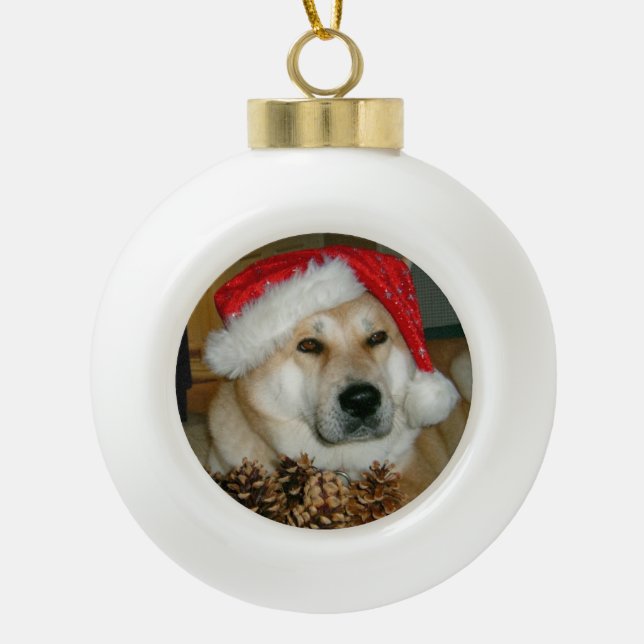 cute akita dog dressed for christmas  ceramic ball christmas ornament (Front)