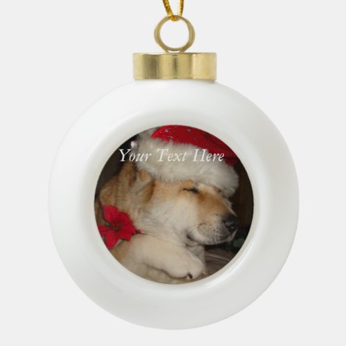 cute akita in christmas santa hat giving paw ceramic ball christmas ornament