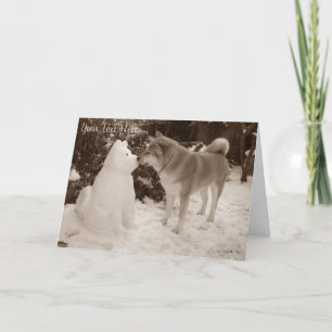 cute akita kissing snowman snow dog at christmas holiday card