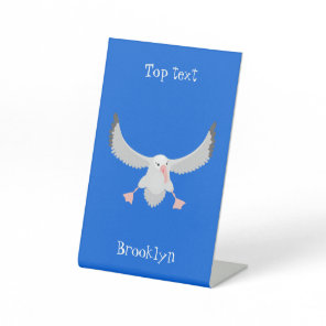 Cute albatross bird flying cartoon illustration pedestal sign