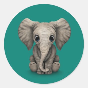 Cute Baby Elephant Calf Sitting Down  Teal Blue Classic Round Sticker by crazycreatures at Zazzle