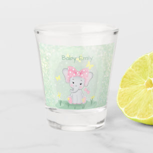 Cute baby elephant with a pink bow in a clearing Shot Glass