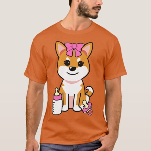 cute baby orange dog wears a pink ribbon T_Shirt