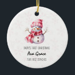 Cute Baby's First Christmas Winter Snowman  Ceramic Ornament<br><div class="desc">Cute Baby's First Christmas Winter Snowman Ceramic Ornament Celebrate your little one's first holiday season with our Cute Baby's First Christmas Winter Snowman Ceramic Ornament. This adorable ornament features a charming snowman design, perfect for commemorating a special milestone. Crafted from high-quality ceramic, it includes a festive illustration of a snowman...</div>