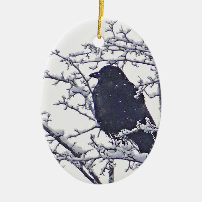 Cute black bird in snowy branches  ceramic ornament (Front)