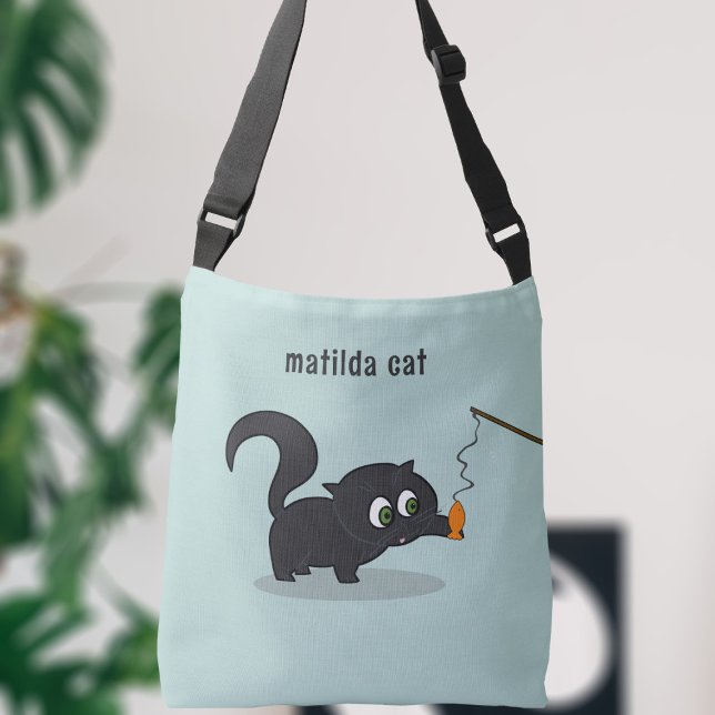Cute Black Cat Blue Crossbody Bag (A cute little black kitty cat playing with her fish. Just add your name!)