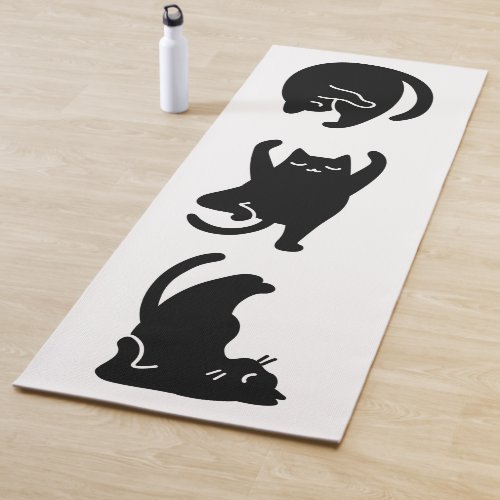 Cute black cat doing yoga  yoga mat