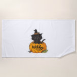 Cute black cat in pumpkin with witch hat, kawaii s beach towel
