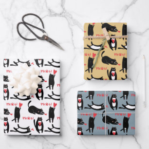 Cute black cats playing with hearts and meow wrapping paper sheets