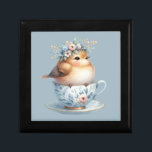 Cute Blue Bird with Floral Crown in Teacup Gift Box<br><div class="desc">This delightful artwork captures a fluffy baby bird nestled inside a delicate vintage teacup, adorned with soft blue and blush floral patterns. Perched contentedly, the bird wears a whimsical crown of pastel blossoms and greenery, radiating warmth and innocence. The composition blends a romantic tea party aesthetic with cottagecore charm, highlighted...</div>