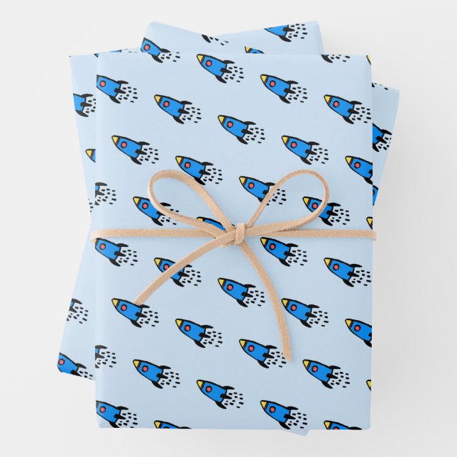 Cute blue rocket wrapping paper sheets (In situ)