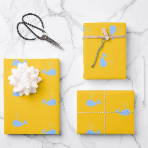 Cute blue whales on orange wrapping paper sheets