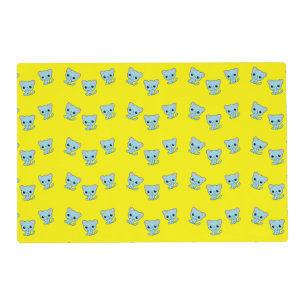 Cute bouncy blue kitten on yellow placemat