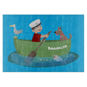 Cute boy sailor and dog rowing boat cartoon cutting board