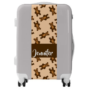 Cute brown bear on pink luggage