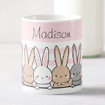 Cute Bunnies Personalized Coffee Mug<br><div class="desc">Enjoy your favorite beverages in style with this adorable custom name mug, featuring a charming row of cute bunnies set against a soft pink background. Perfect for kids and animal lovers alike, this high-quality mug can be personalized with any name, making it a unique and thoughtful gift. Whether for morning...</div>