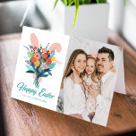 Cute Bunny Bouquet Easter Photo Holiday Card<br><div class="desc">Cute Easter photo card featuring a bunny holding a bouquet of colorful spring flowers with a pink background. "Happy Easter" is displayed in bold teal script lettering with your name shown below. The inside of the card features space for your typed or handwritten message. The back of the card features...</div>