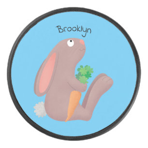 Cute bunny rabbit sitting with carrot cartoon hockey puck