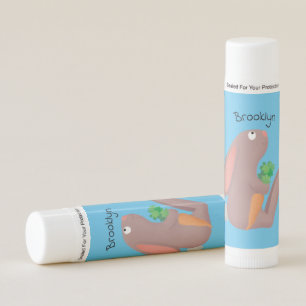 Cute bunny rabbit sitting with carrot cartoon lip balm
